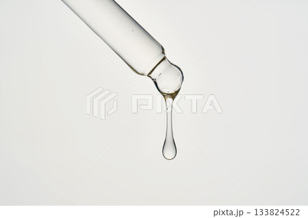 Cosmetic pipette dispensing serum drop for skincare Cosmetic pipette dispensing serum drop for skincare 133824522