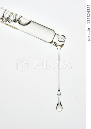Cosmetic pipette dispensing serum drop liquid skincare product Cosmetic pipette dispensing serum drop liquid skincare product 133824523