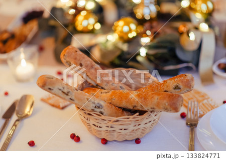 Breadsticks at christmas table. Christmas dinner at home. 133824771