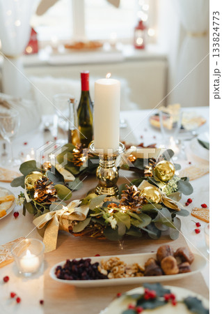 A table set for dinner meal at Christmas time. A table set for dinner meal at Christmas time. 133824773