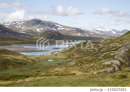 Breathtaking view of Jotunheimen National Park during a hike from Bygdin hotel to Synshorn mountain Breathtaking view of Jotunheimen National Park during a hike from Bygdin hotel to Synshorn mountain 133825881