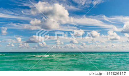 Calm horizon at sea. Romantic summer vacation seascape. Seascape horizon paradise. Sea sunrise on ocean beach. Sunset seascape at summer vacation. Horizon with sea cloudy sky. Stormy sea Calm horizon at sea. Romantic summer vacation seascape. Seascape horizon paradise. Sea sunrise on ocean beach. Sunset seascape at summer vacation. Horizon with sea cloudy sky. Stormy sea 133826137