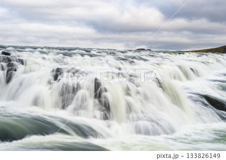 Gullfoss waterfall nature. Waterfall river cascade. Iceland nature river flow. Picturesque Gullfoss waterfall creek. Nature wildness. River flow cascade. Waterfall creek flow Gullfoss waterfall nature. Waterfall river cascade. Iceland nature river flow. Picturesque Gullfoss waterfall creek. Nature wildness. River flow cascade. Waterfall creek flow 133826149