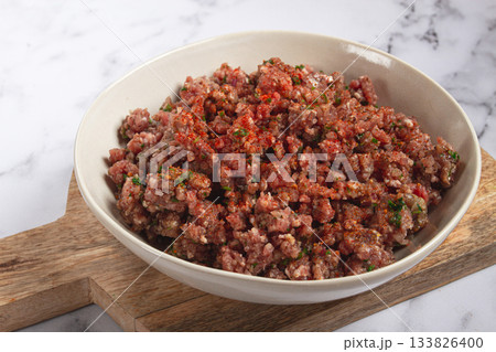 raw minced meat, marinated with spices and herbs, in a bowl, minced meat with spices, top view, homemade, no people, 133826400