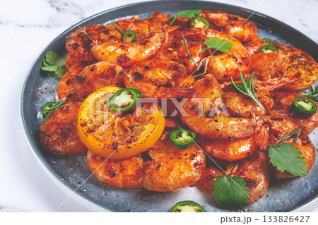 grilled shrimp, unpeeled, headless, with spices, on a marble table, homemade, no people, grilled shrimp, unpeeled, headless, with spices, on a marble table, homemade, no people, 133826427