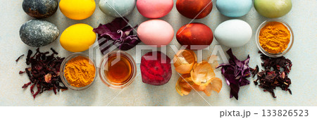Brightly colored Easter eggs , showcasing various hues created from natural dye sources. Fresh ingredients are displayed alongside such as beets, turmeric and hibiscus, cabbage and onion peel, vinegar Brightly colored Easter eggs , showcasing various hues created from natural dye sources. Fresh ingredients are displayed alongside such as beets, turmeric and hibiscus, cabbage and onion peel, vinegar 133826523