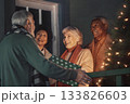 ?he seniors welcome guests at the doorstep. 133826603