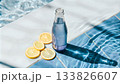 A chilled bottle of mineral water and lemon 133826607