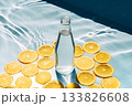 Still life with bottle of water and lemon slices 133826608