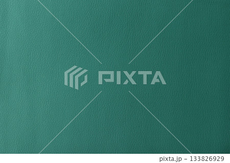 Texture of genuine leather, artificial leatherette green background 133826929