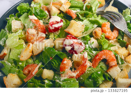Caesar salad, with shrimp, on a marble background, top view, no people, 133827195