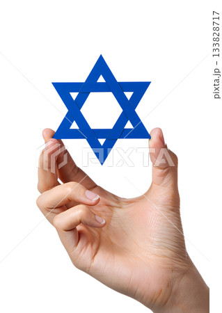 Hand gently holding blue star of david (magen david), symbol of judaism, faith, jewish identity isolated on transparent background 133828717