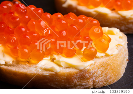 Sandwiches with red caviar. 133829190