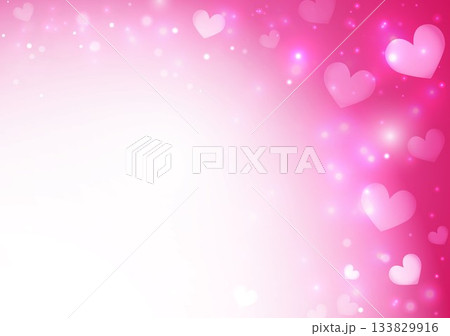 ピンク色のキラキラした背景の中にハート 133829916