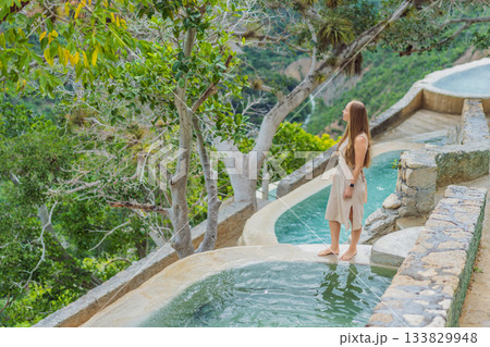 Female tourist exploring Grutas Tolantongo in Mexico, enjoying natural hot springs, scenic caves, and outdoor adventure. Travel, wellness, and sightseeing concept Female tourist exploring Grutas Tolantongo in Mexico, enjoying natural hot springs, scenic caves, and outdoor adventure. Travel, wellness, and sightseeing concept 133829948
