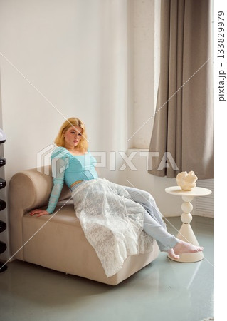 serene artist resting in cozy space, lightfilled room with peaceful atmosphere and artistic ambiance 133829979