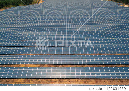 Aerial drone view of vast solar power farm with 133831629