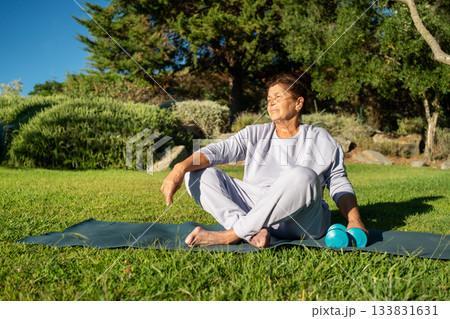 Relaxed thoughtful senior woman sitting on Relaxed thoughtful senior woman sitting on 133831631
