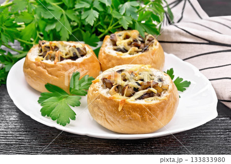 Buns stuffed with mushrooms in plate on black board Buns stuffed with mushrooms in plate on black board 133833980