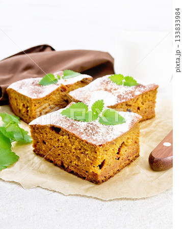 Cake pumpkin and chocolate on granite countertop Cake pumpkin and chocolate on granite countertop 133833984