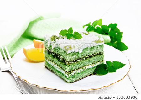 Cake with orange and mint in plate on board 133833986