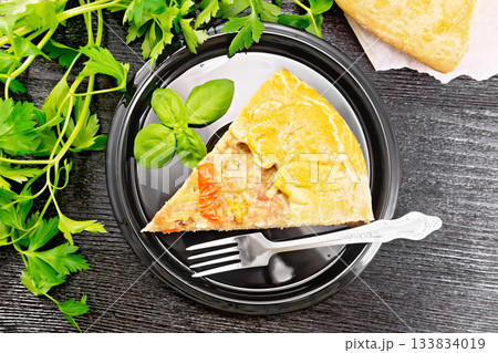Galette with minced meat and peppers in plate on board top Galette with minced meat and peppers in plate on board top 133834019