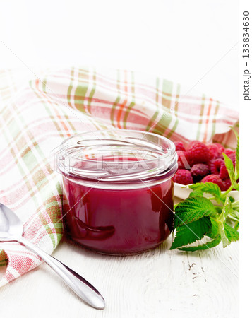 Jam of raspberry in jar on wooden board 133834630