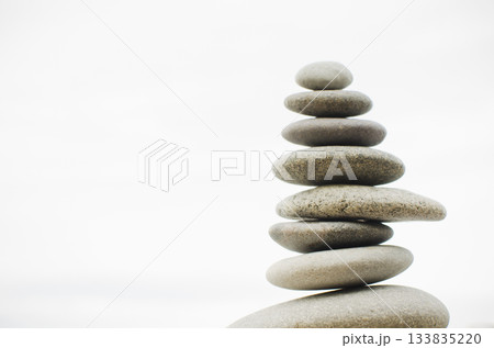 Close-up of cairn by lake 133835220