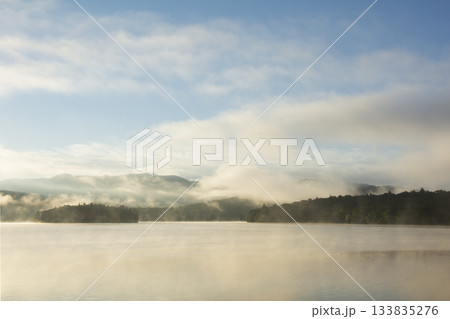 Morning mist on calm Lake Placid 133835276