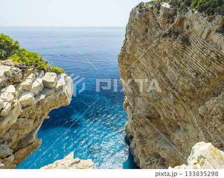 Cliffs and calm blue sea Cliffs and calm blue sea 133835298