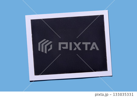 Blank Polaroid on blue background 133835331