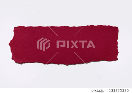 Torn red paper on white background Torn red paper on white background 133835380