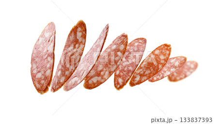 Sausage slices levitate on a white background 133837393