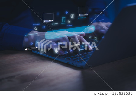 Man using a laptop computer with digital interface for video content moderation. Concept of online streaming, video platform, content removal, copyright protection, AI moderation and digital safety. 133838530
