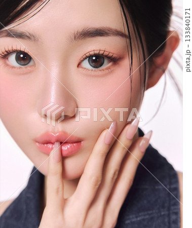 Portrait of a beautiful young Asian woman with makeup and smooth skin Portrait of a beautiful young Asian woman with makeup and smooth skin 133840171