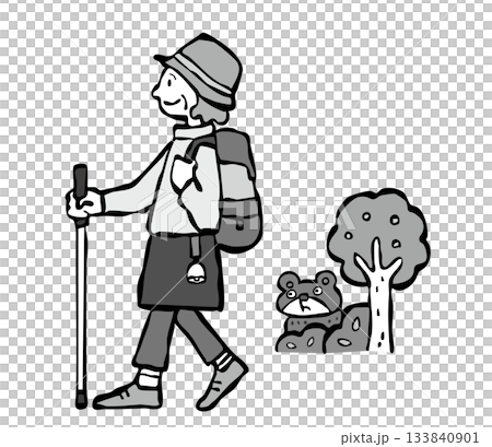 熊よけの鈴をつけてハイキングをする女性(シニア) 熊よけの鈴をつけてハイキングをする女性(シニア) 133840901