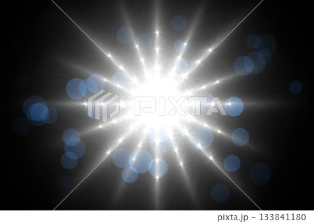 Radiant white light is emitting star-like rays across dark field in flat design, with blue bokeh 133841180