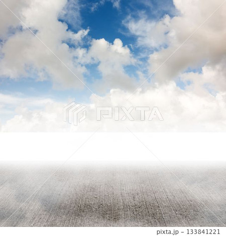 Flat design illustration featuring concrete ground beneath cumulus cloud filled sky, copy space 133841221