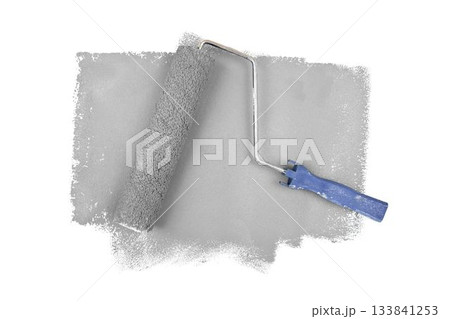 Gray paint roller over white background 133841253