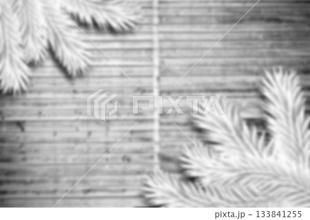 Blurred fir branches on wood 133841255