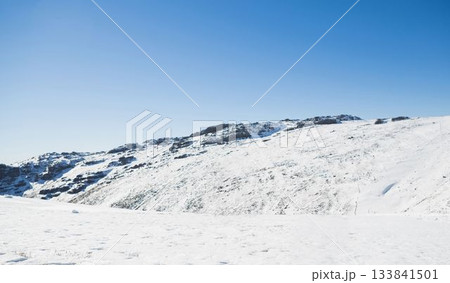 Snowy mountain under blue sky 133841501