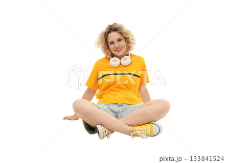 Woman in casual wear with headphones seated, isolated on white, PNG Woman in casual wear with headphones seated, isolated on white, PNG 133841524