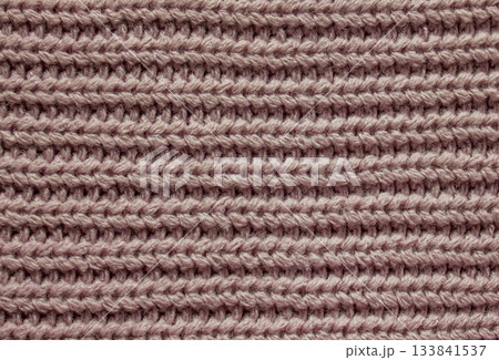 Classic Knitted Woolen Sweater texture. Soft pink knitted sweater fabric with cozy yarn details. Classic Knitted Woolen Sweater texture. Soft pink knitted sweater fabric with cozy yarn details. 133841537