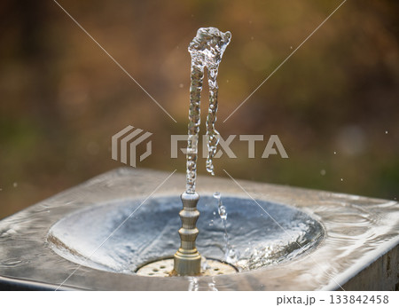 A fountain with water shooting out of it A fountain with water shooting out of it 133842458
