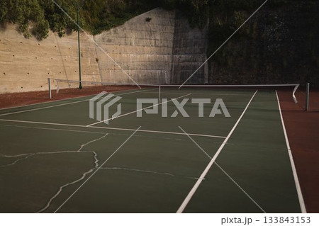 Flat design tennis court surface is showing cracks, white lines and sagging net with lamp post Flat design tennis court surface is showing cracks, white lines and sagging net with lamp post 133843153