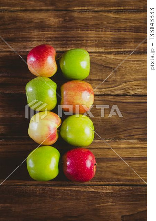 Red and green apples on table 133843333