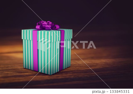Flat design mint green striped gift box is sitting on wooden tabletop, with purple ribbon bow 133845331