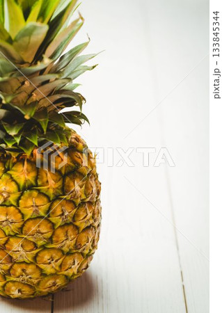 Fresh pineapple on wooden table Fresh pineapple on wooden table 133845344