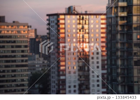 Blurry view of cityscape at dusk 133845433