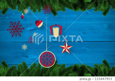 Christmas baubles in front of wood 133847953